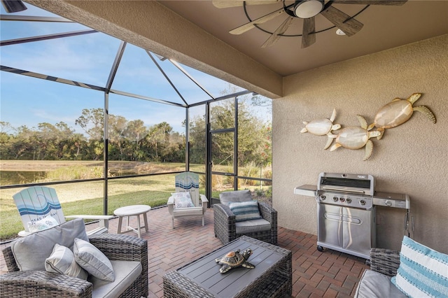 view of patio / terrace with ceiling fan, a grill, a lanai, and an outdoor hangout area