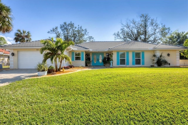 single story home with french doors, a front lawn, and a garage