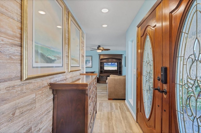 hall with light hardwood / wood-style floors