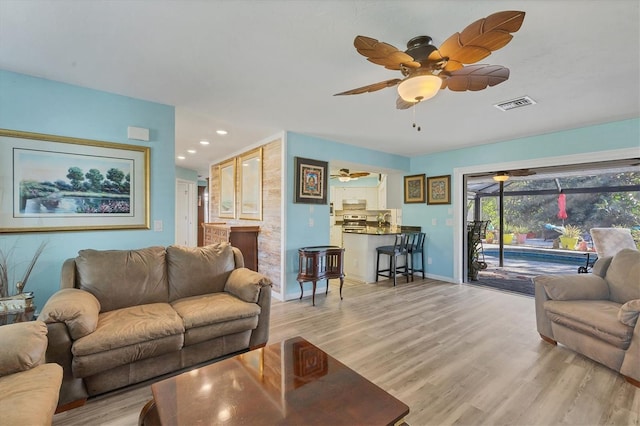 living room with light hardwood / wood-style floors