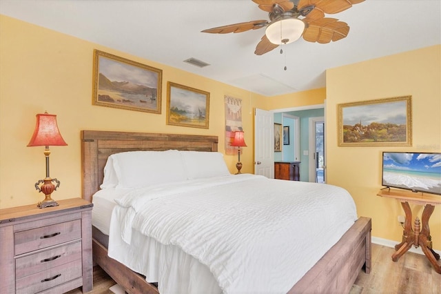 bedroom with ceiling fan and light hardwood / wood-style flooring