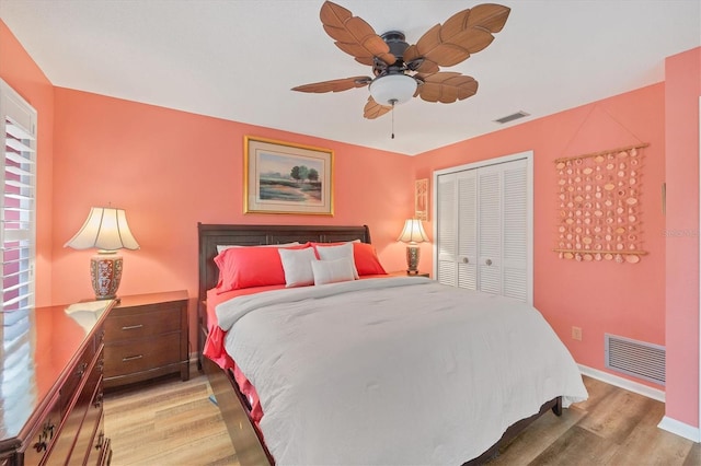 bedroom featuring ceiling fan, a closet, and hardwood / wood-style floors