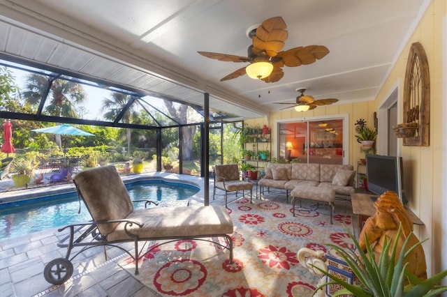 sunroom / solarium featuring ceiling fan, a healthy amount of sunlight, and a pool