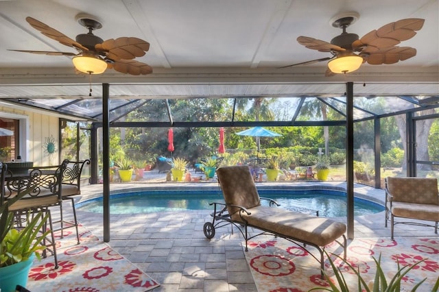 view of pool featuring ceiling fan