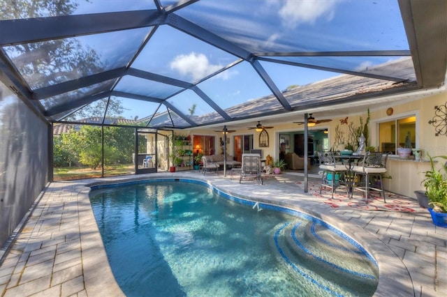 view of pool with a lanai and a patio