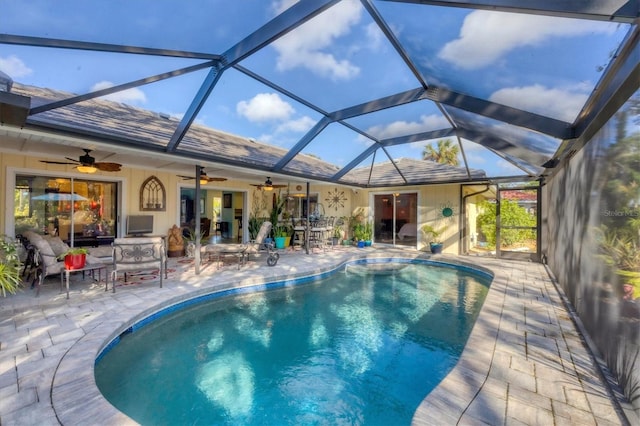 view of swimming pool with a lanai and a patio