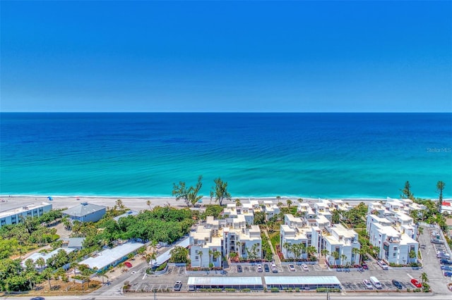 birds eye view of property featuring a water view and a view of the beach