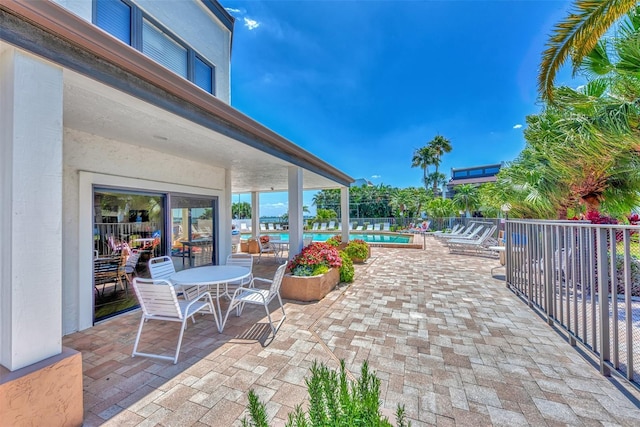 view of patio / terrace featuring a community pool