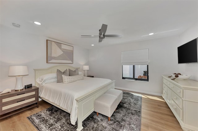 bedroom featuring light hardwood / wood-style flooring and ceiling fan