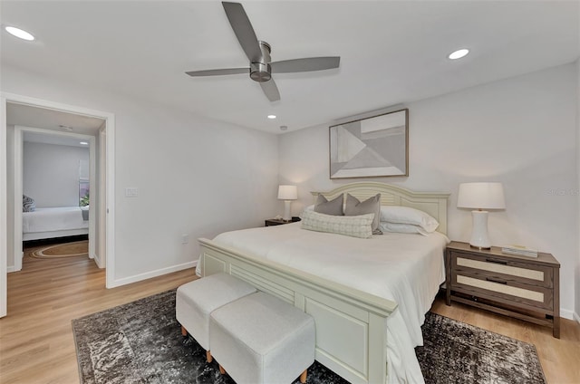 bedroom featuring light hardwood / wood-style floors and ceiling fan