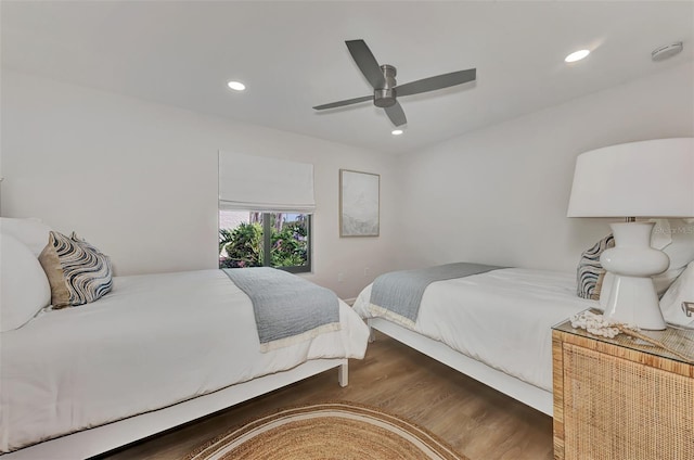 bedroom with ceiling fan and dark hardwood / wood-style floors