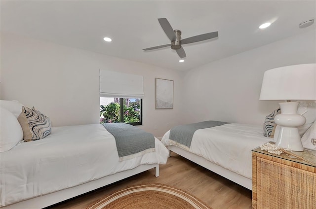 bedroom with ceiling fan and hardwood / wood-style floors