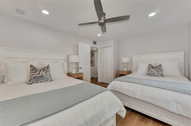 bedroom with ceiling fan and dark hardwood / wood-style flooring