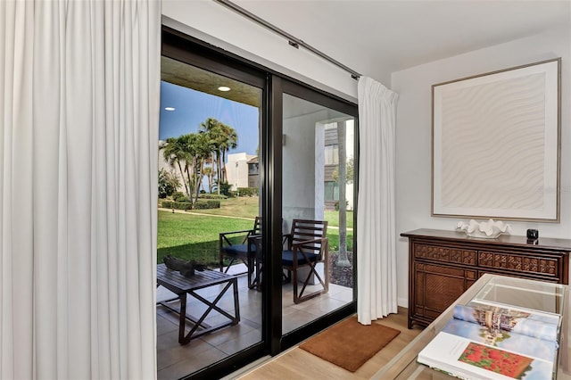 doorway to outside featuring hardwood / wood-style flooring