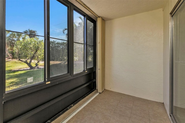 unfurnished sunroom featuring plenty of natural light