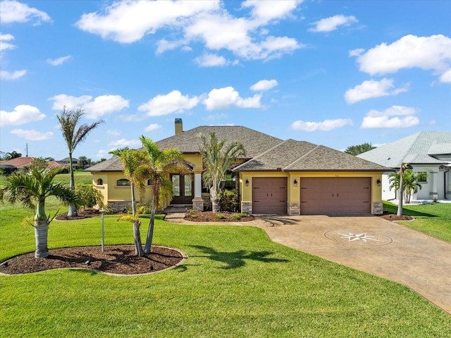 view of front of home featuring a front yard and a garage