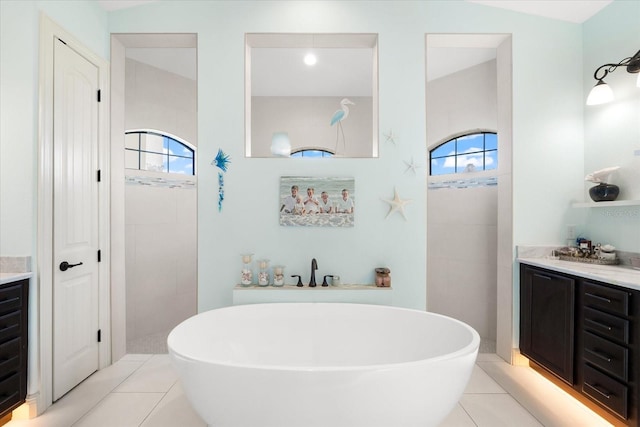 bathroom with vanity, tile patterned floors, and a wealth of natural light