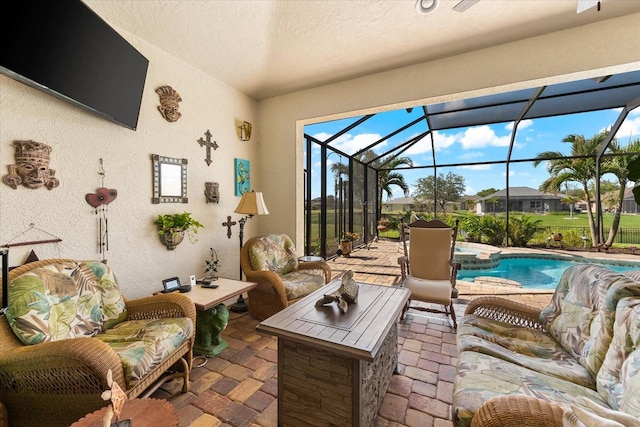 view of patio featuring glass enclosure