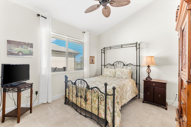 bedroom with ceiling fan, light carpet, and lofted ceiling