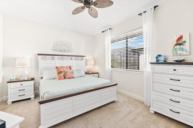 bedroom with light colored carpet and ceiling fan