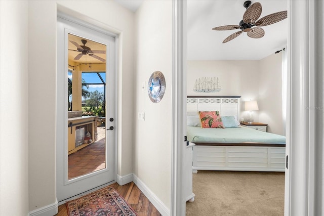 carpeted bedroom with ceiling fan and access to exterior