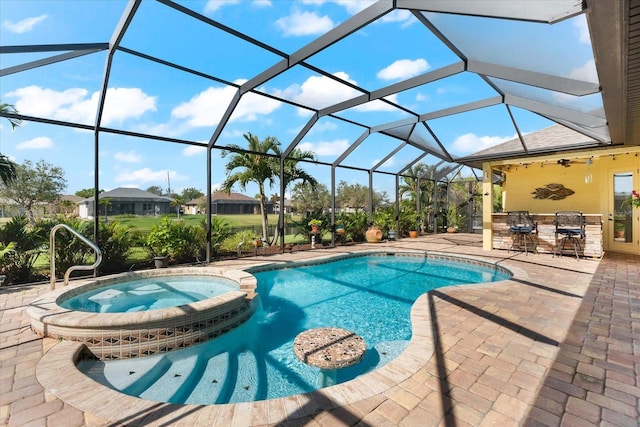 view of swimming pool featuring a lanai, a patio area, an in ground hot tub, and an outdoor bar