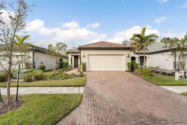 mediterranean / spanish-style house featuring a garage