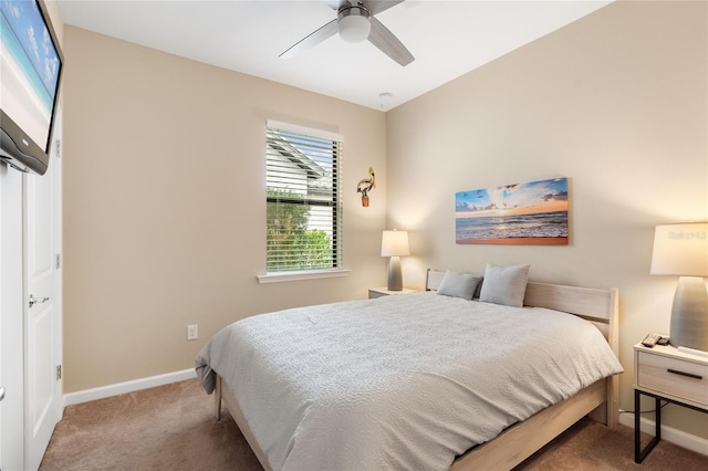 bedroom featuring ceiling fan and carpet