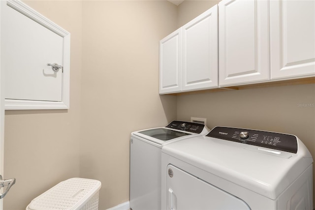 laundry room featuring cabinets and independent washer and dryer