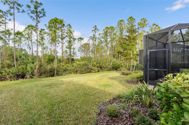 view of yard featuring a lanai