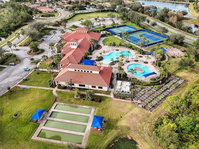 birds eye view of property with a water view