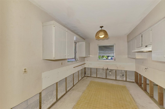 kitchen featuring white cabinets and decorative light fixtures