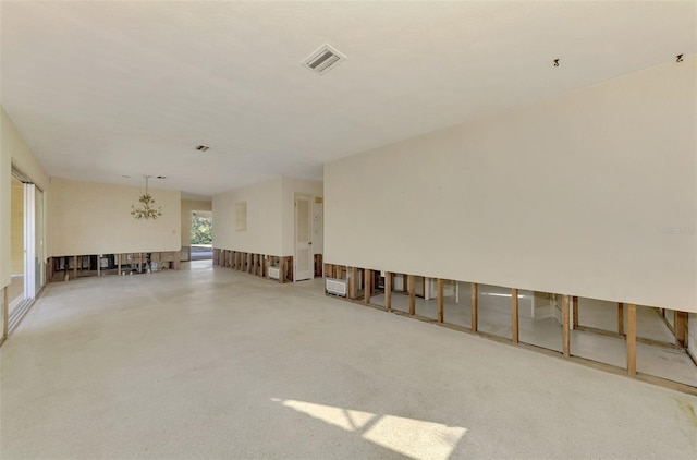 empty room featuring a notable chandelier