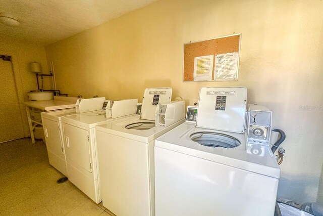 laundry room featuring washer and clothes dryer