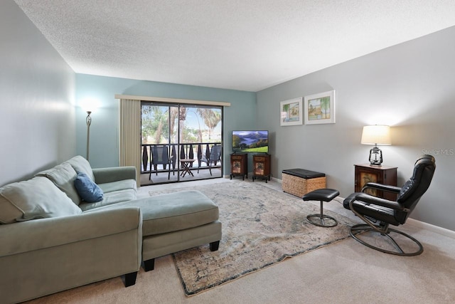 carpeted living room featuring a textured ceiling