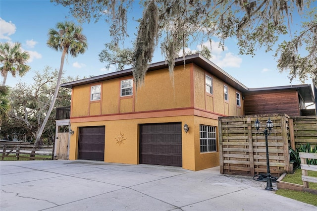 view of side of property featuring a garage