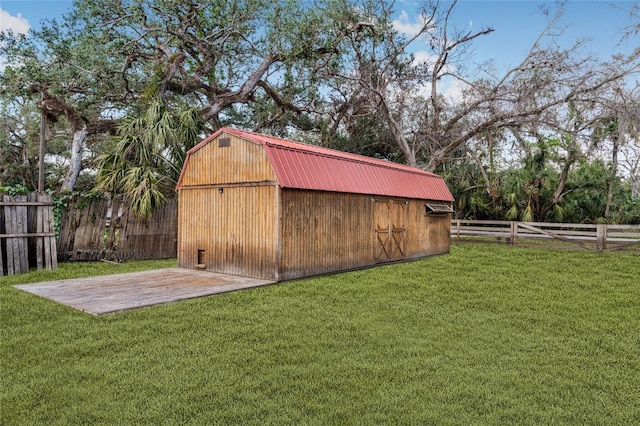 view of outbuilding with a yard