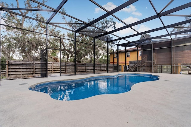 view of pool with a lanai and a patio area