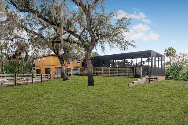 view of yard featuring glass enclosure