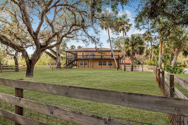 exterior space featuring a deck and a front lawn