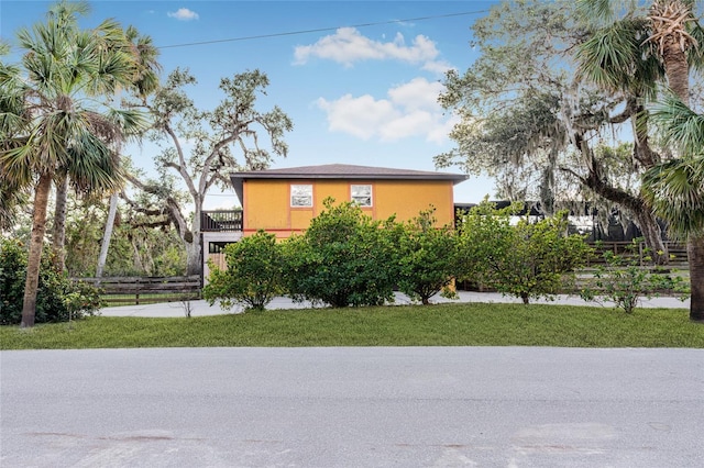 view of side of home with a lawn