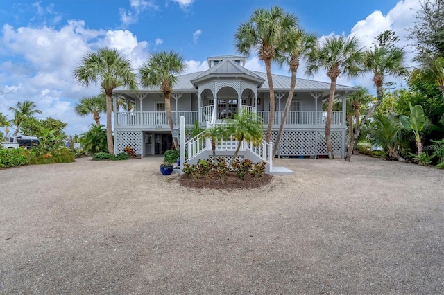 view of front of house featuring a carport and covered porch