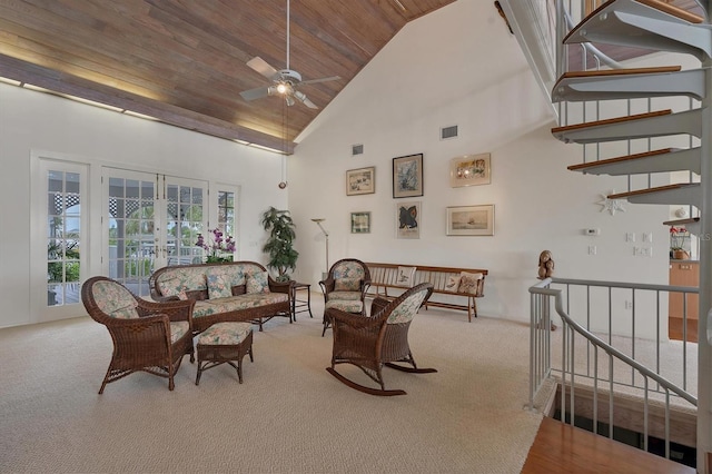 interior space featuring ceiling fan, high vaulted ceiling, light carpet, wooden ceiling, and french doors