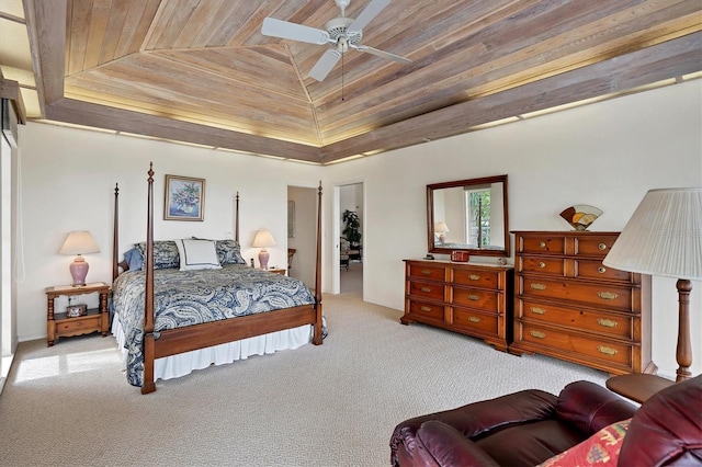 carpeted bedroom with vaulted ceiling and ceiling fan