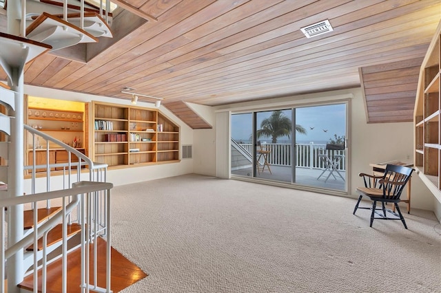 bonus room featuring carpet floors, wooden ceiling, and built in shelves