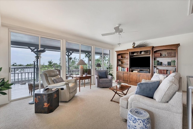 living room featuring ceiling fan and light carpet