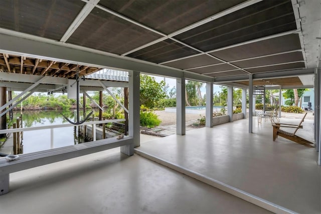 unfurnished sunroom with a water view and a wealth of natural light