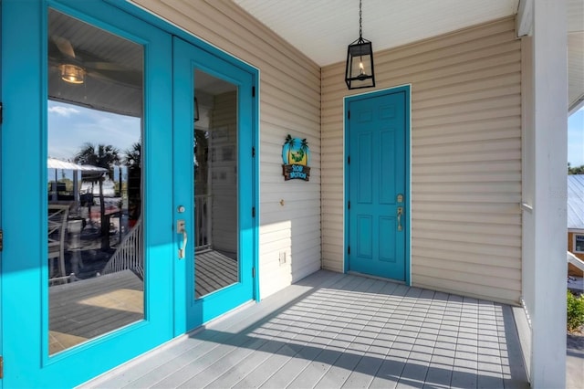 doorway to property with french doors and a porch