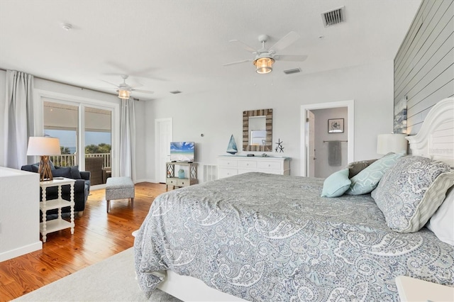 bedroom featuring access to outside, hardwood / wood-style flooring, and ceiling fan