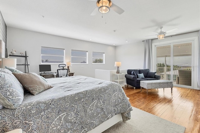 bedroom with access to outside, ceiling fan, and wood-type flooring